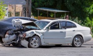 cars after accident in middle of road