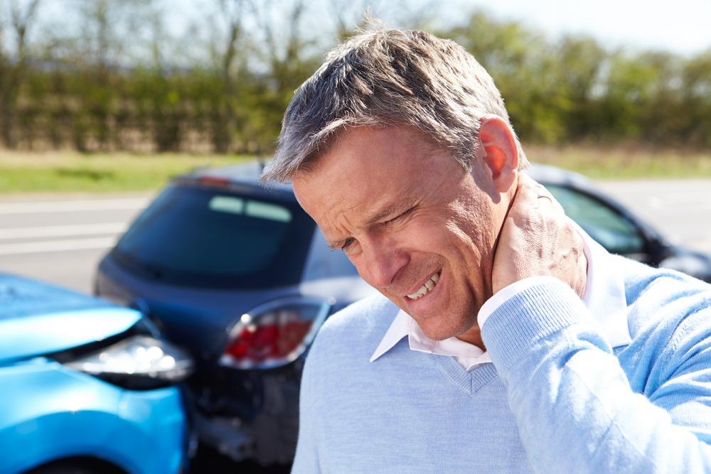 Covington Car Accident Lawyers | Kaine Law | Free Consultations man with whiplash after car accident