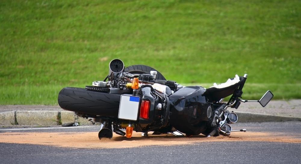 When Should I Contact a Lawyer After a Motorcycle Accident? | Kaine Law motorcycle accident in middle of street