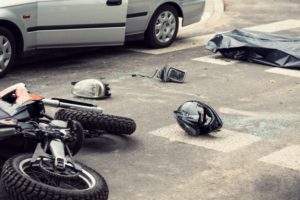 motorcycle accident involving car on road