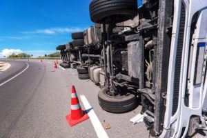 overturned big-rig with cones